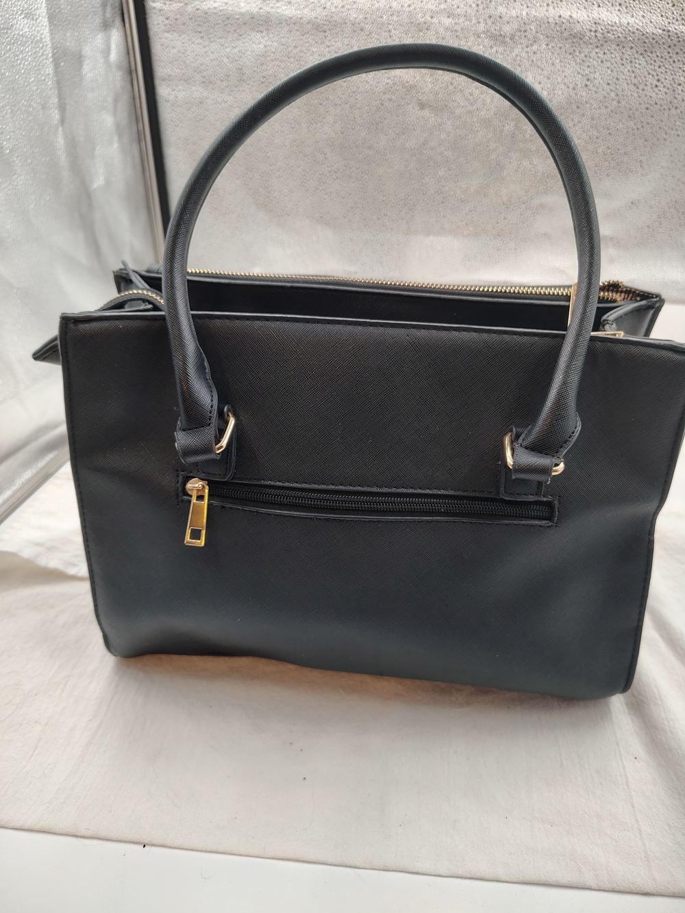 Structured Black Shoulder Handbag with Gold Accents